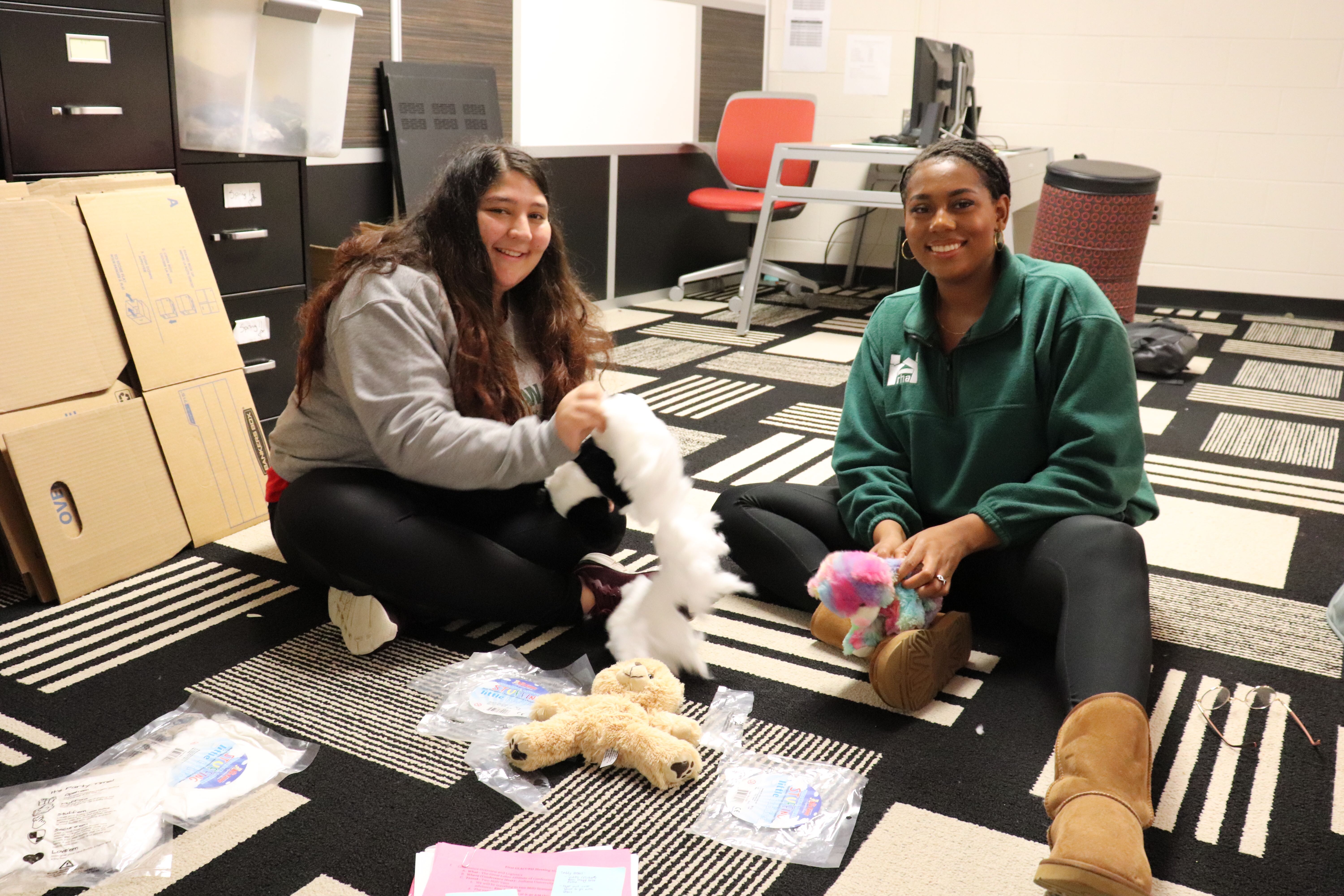Selva (Chief of Staff) and Miyanna (President) stuffing bears at GLACURH